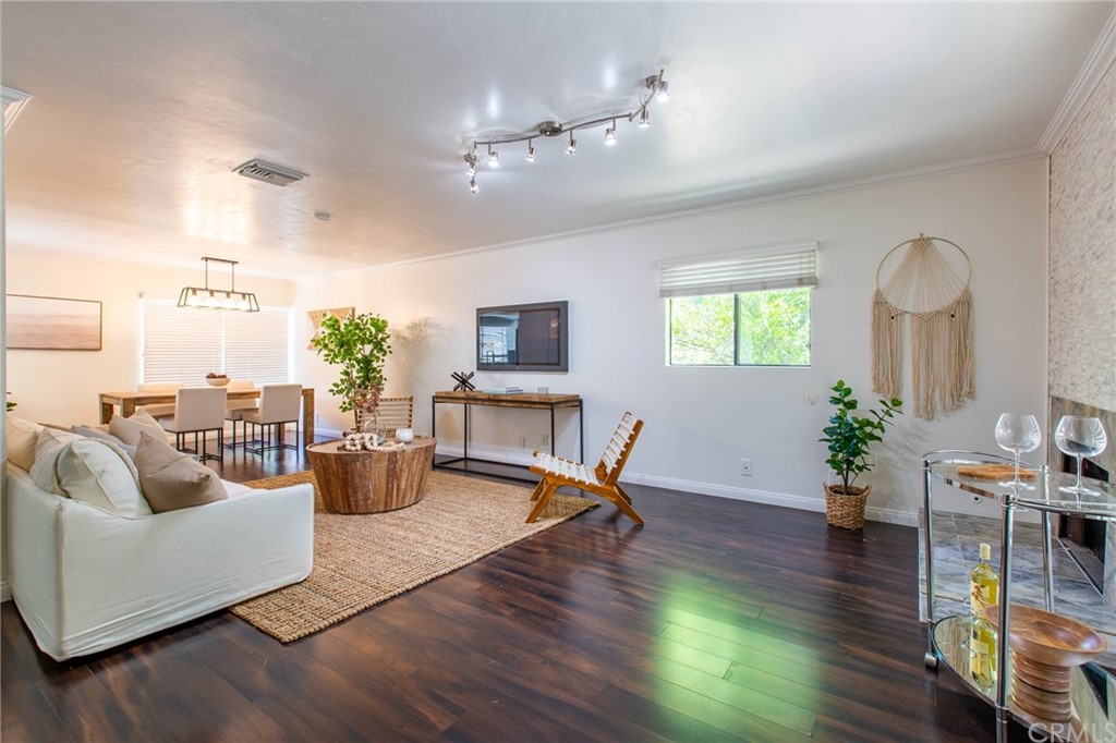 1881 Alpha Road, Unit 5 Glendale, CA 91208 - Photo 3 of 29 a living room with fireplace furniture and a wooden floor