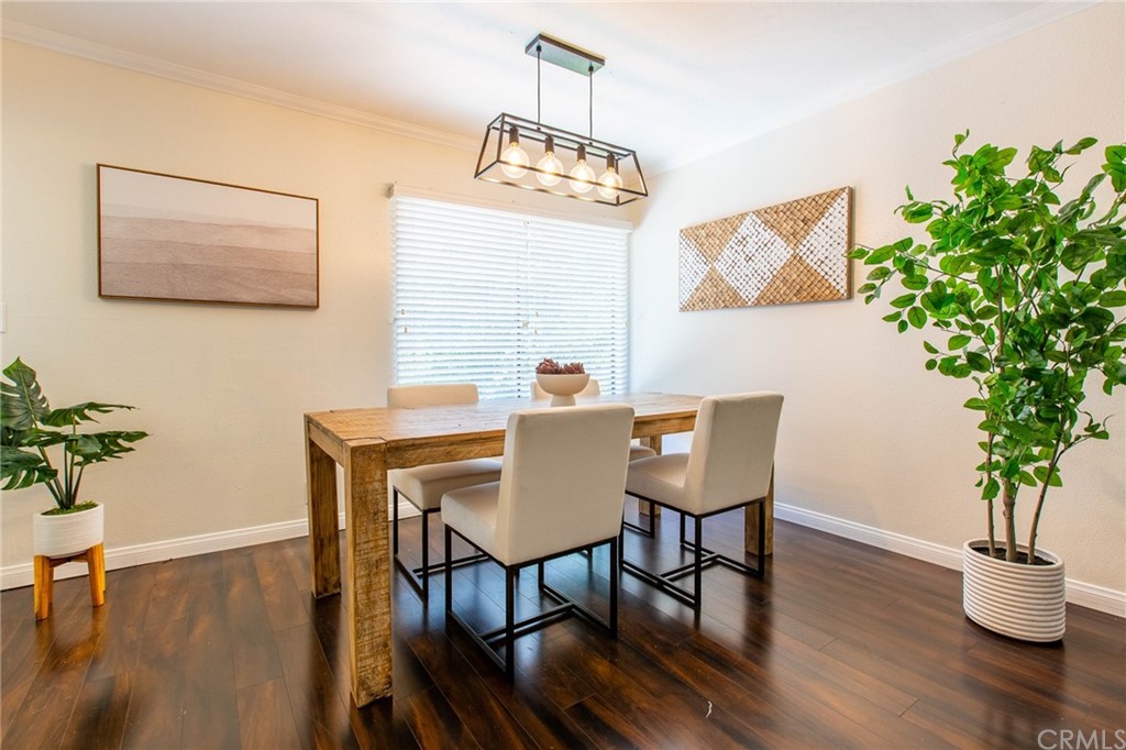 1881 Alpha Road, Unit 5 Glendale, CA 91208 - Photo 5 of 29 a view of a dining room with furniture window and wooden floor