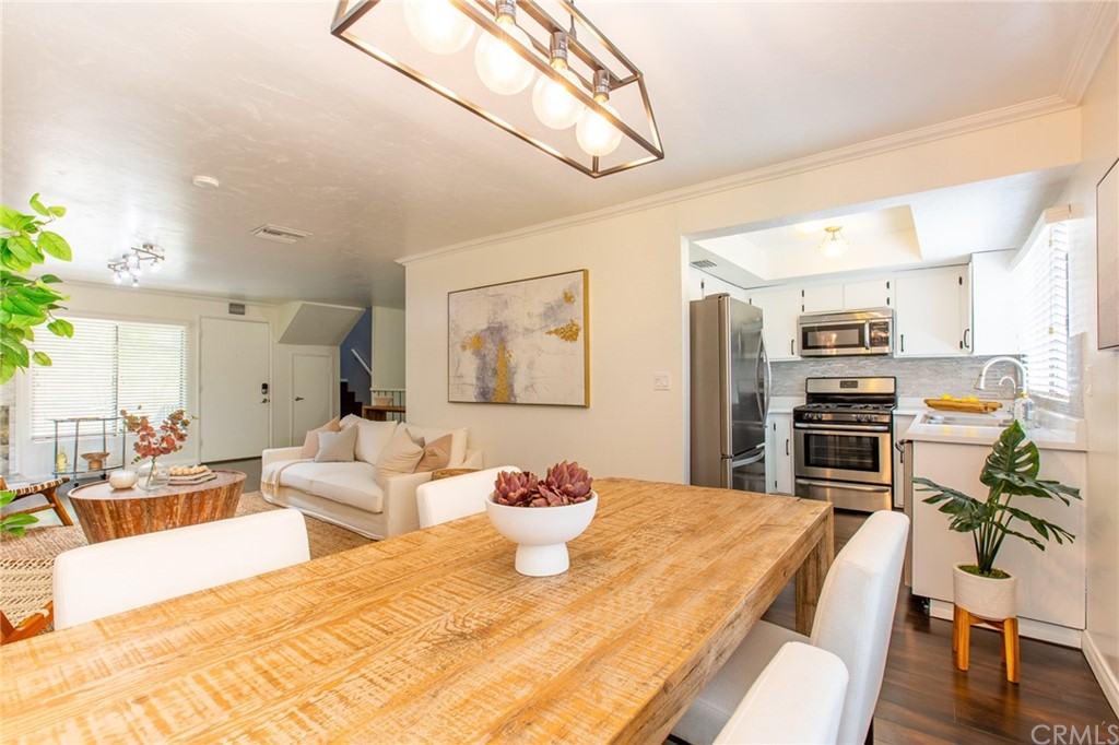 1881 Alpha Road, Unit 5 Glendale, CA 91208 - Photo 7 of 29 a living room with stainless steel appliances furniture and a kitchen view