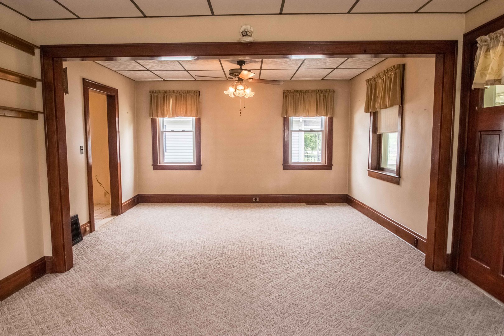 215 Clark Street Georgetown, IL 61846 - Photo 3 of 24 a view of an empty room with a window