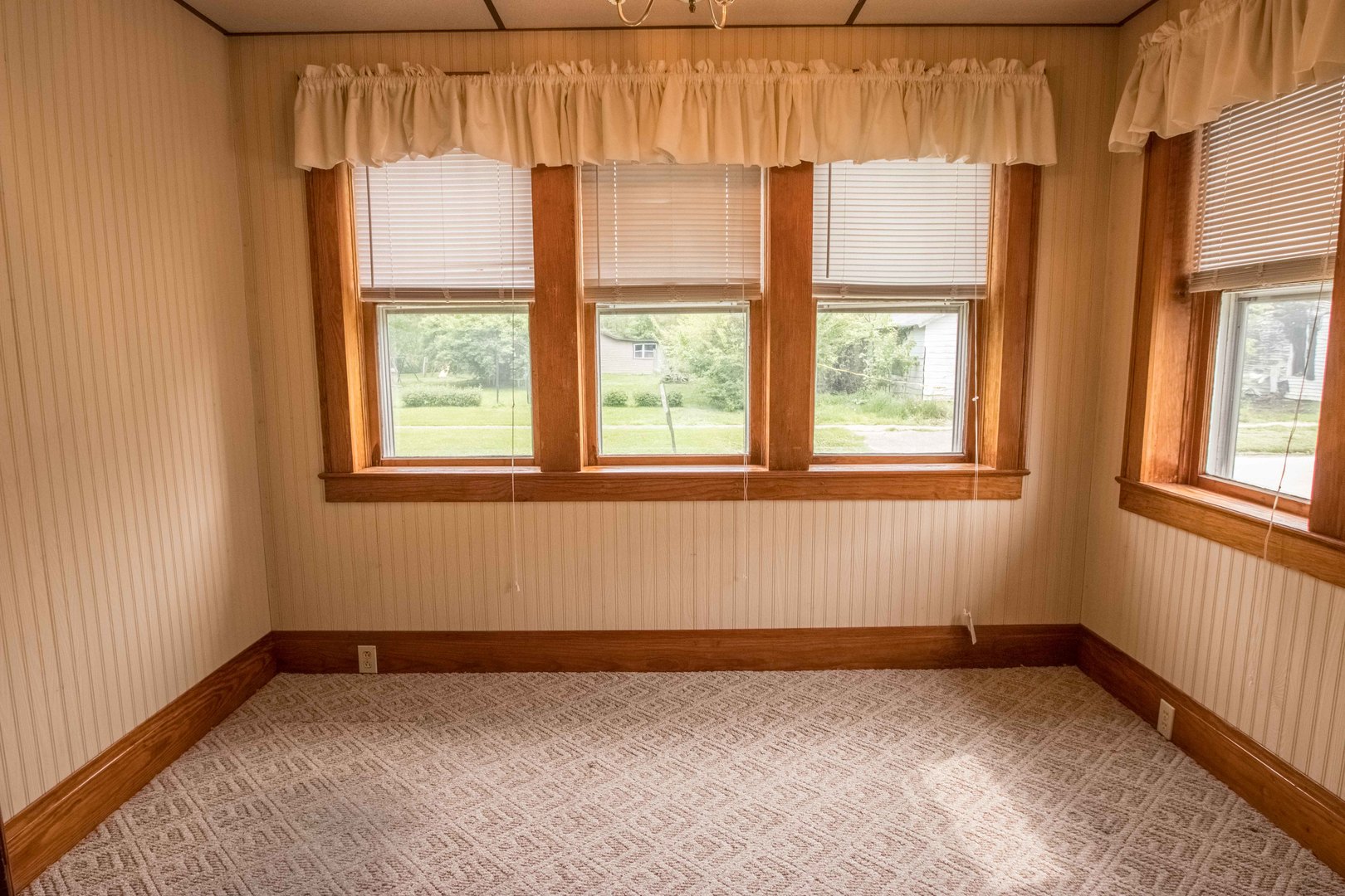 215 Clark Street Georgetown, IL 61846 - Photo 5 of 24 a view of an empty room with a window