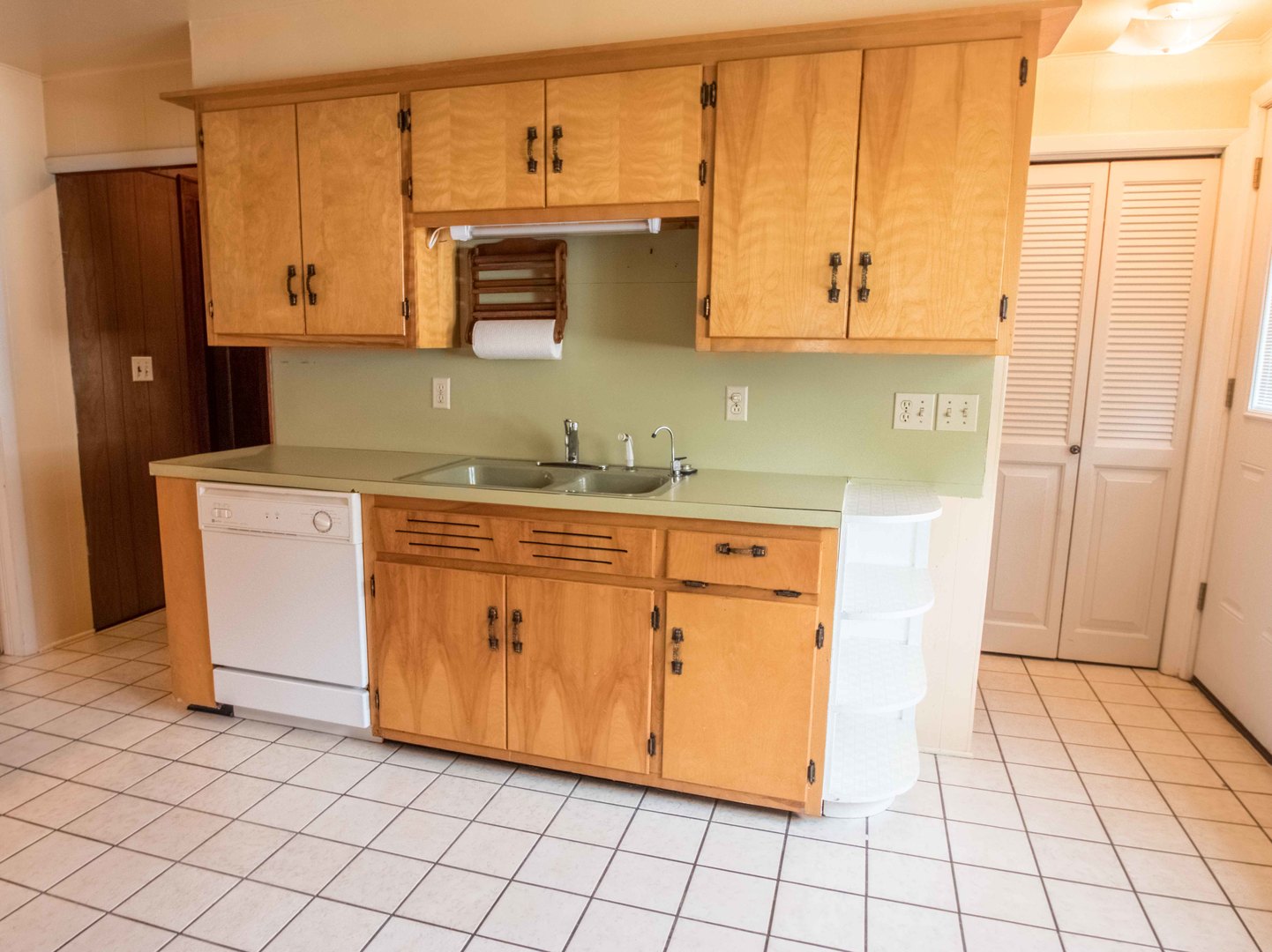 215 Clark Street Georgetown, IL 61846 - Photo 6 of 24 a kitchen with stainless steel appliances a stove a microwave and cabinets
