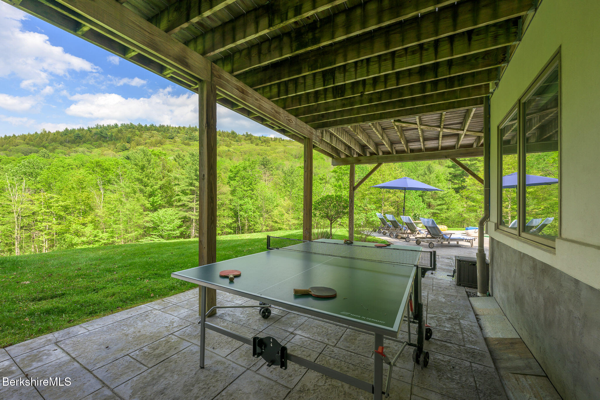 83 Maple Hill Road West Stockbridge, MA 01266 - Photo 67 of 78 a view of a porch with chairs and backyard