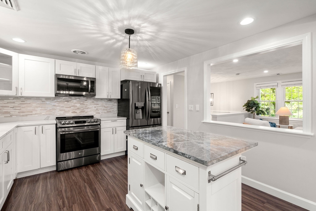 98 Union Street Norfolk, MA 02056 - Photo 11 of 38 a kitchen with granite countertop a sink and steel appliances