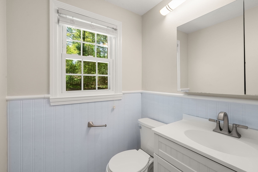 98 Union Street Norfolk, MA 02056 - Photo 18 of 38 a bathroom with a toilet sink and window