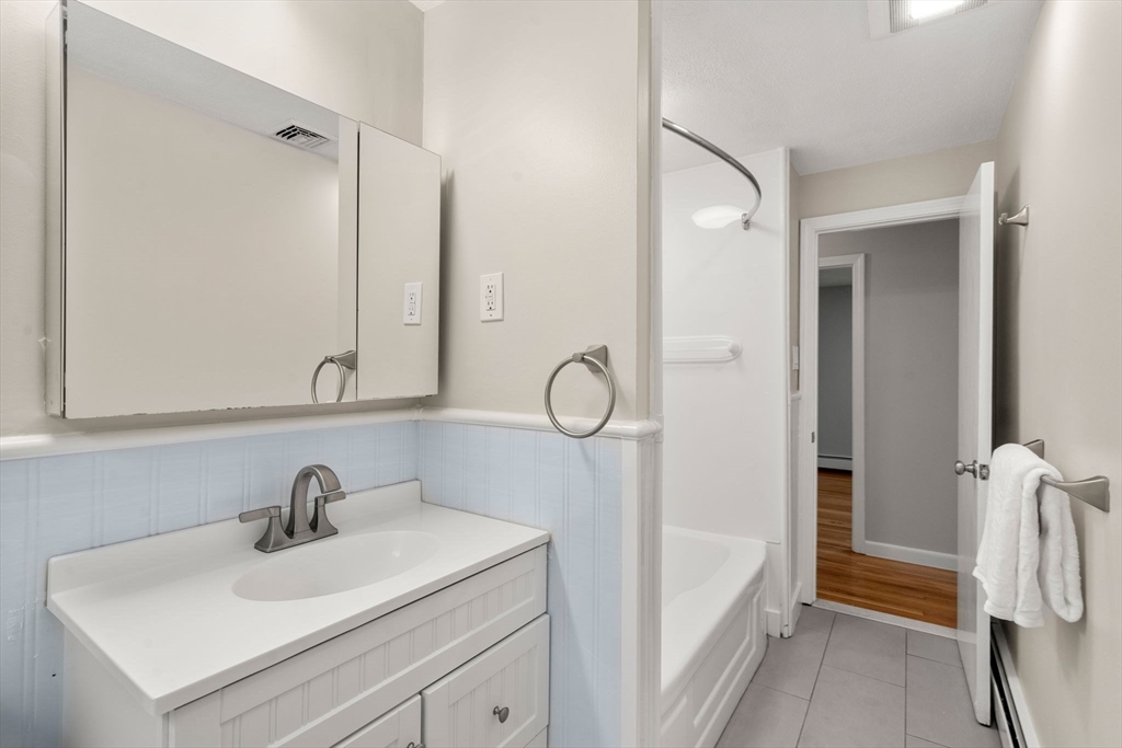 98 Union Street Norfolk, MA 02056 - Photo 19 of 38 a bathroom with a sink and a mirror