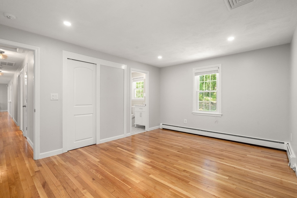98 Union Street Norfolk, MA 02056 - Photo 25 of 38 an empty room with wooden floor and windows