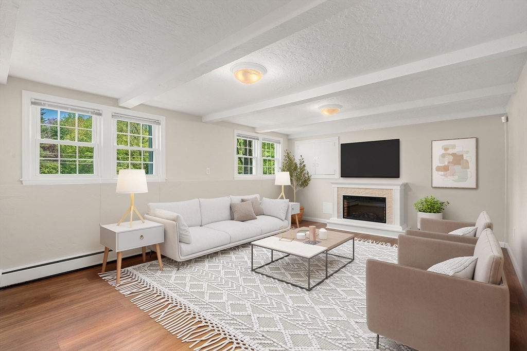 98 Union Street Norfolk, MA 02056 - Photo 30 of 38 a living room with furniture a rug and a window
