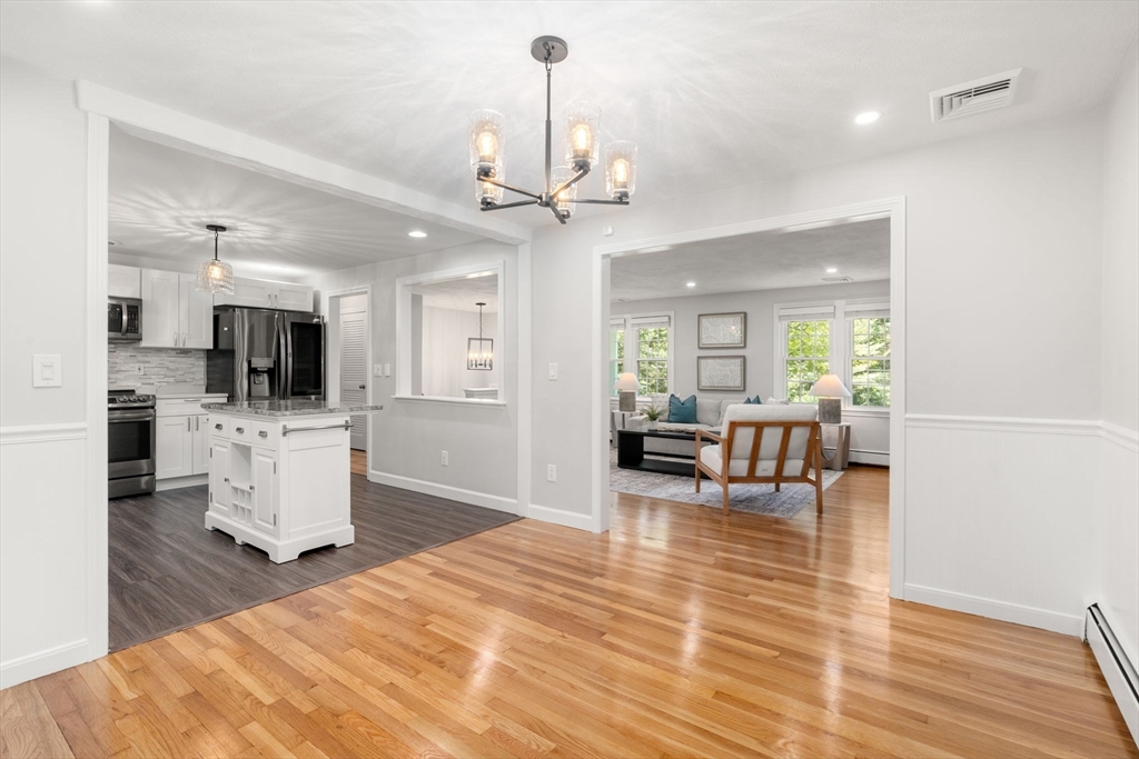 98 Union Street Norfolk, MA 02056 - Photo 8 of 38 a living room with furniture and a flat screen tv