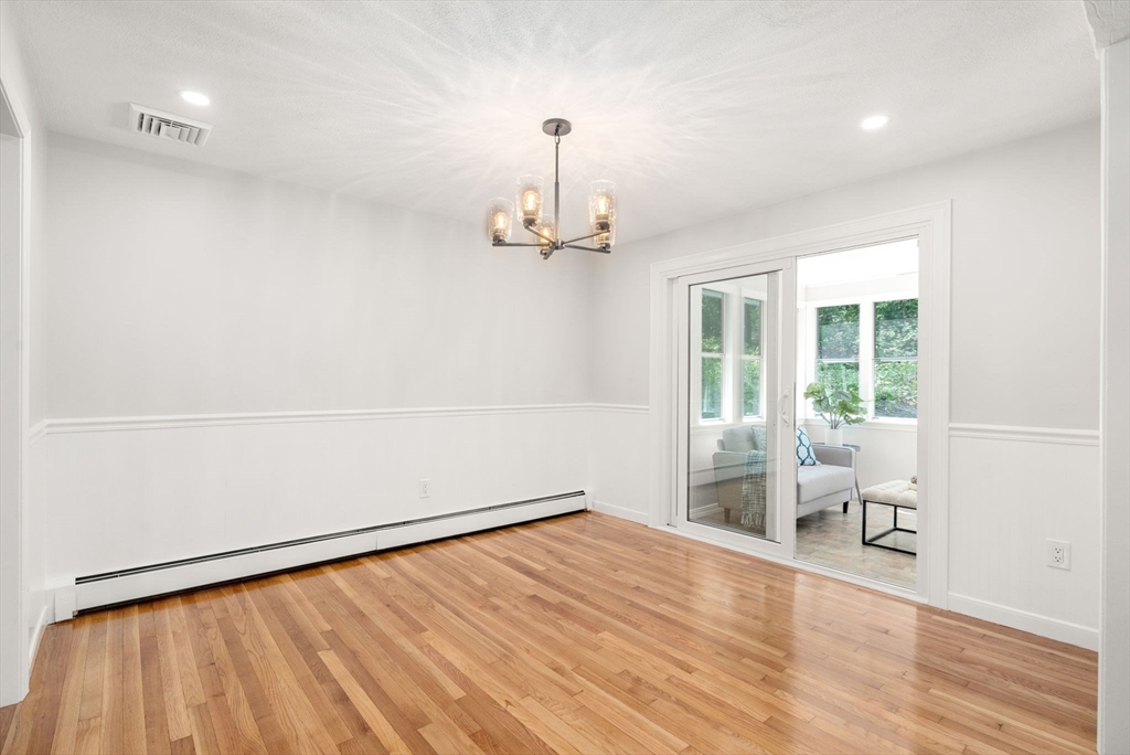 98 Union Street Norfolk, MA 02056 - Photo 9 of 38 a view of empty room with wooden floor and fan