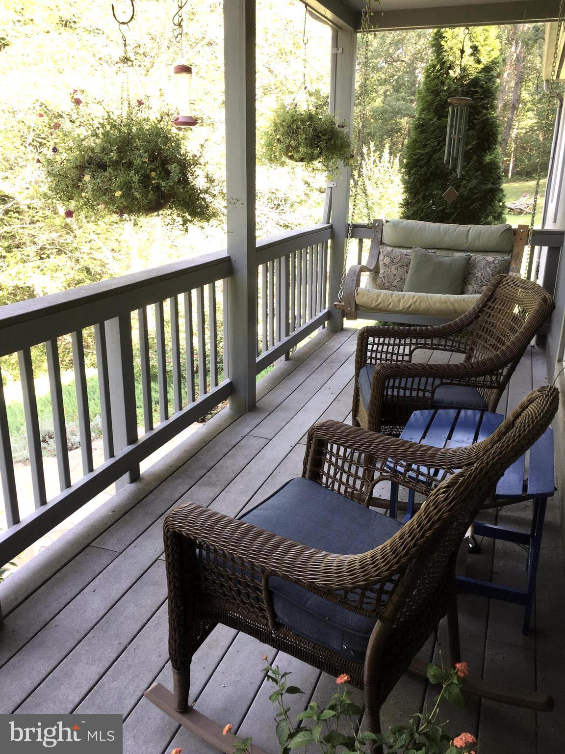 6709 Cabin Branch Road Marshall, VA 20115 - Photo 3 of 26 Front porch with porch swing