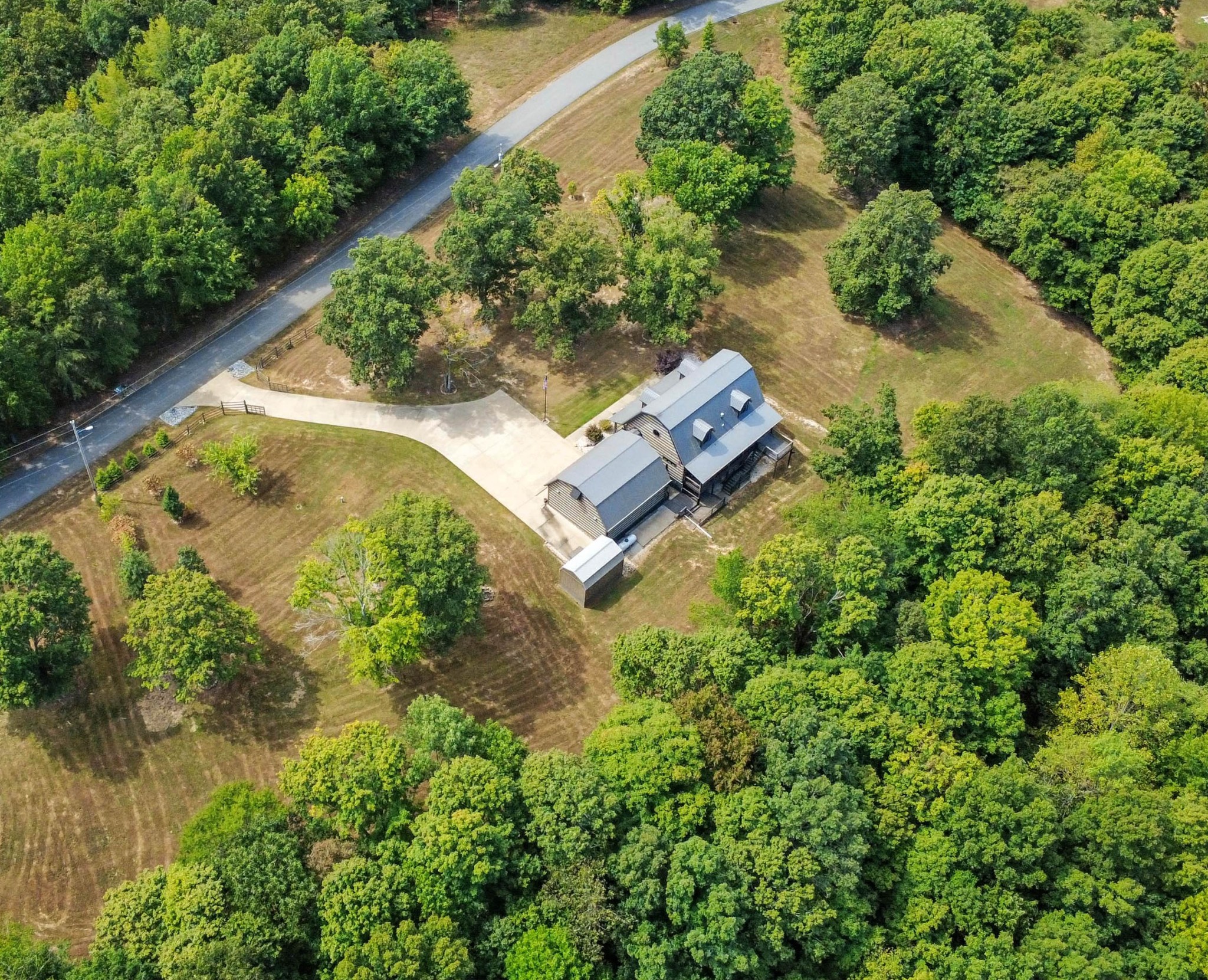 102 Highwater Road Waverly, TN 37185 - Photo 11 of 51 an aerial view of a house with a yard and lake view