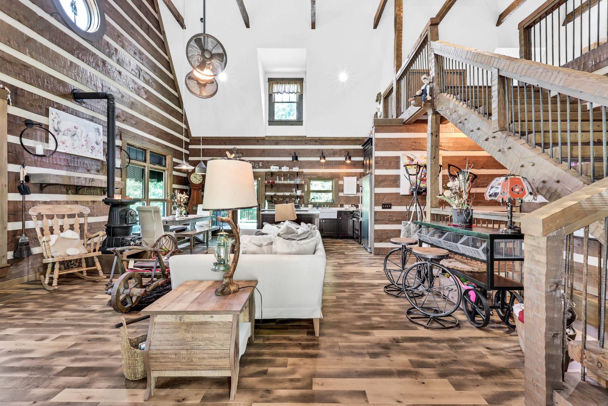 102 Highwater Road Waverly, TN 37185 - Photo 16 of 51 a living room with lots of furniture and a chandelier