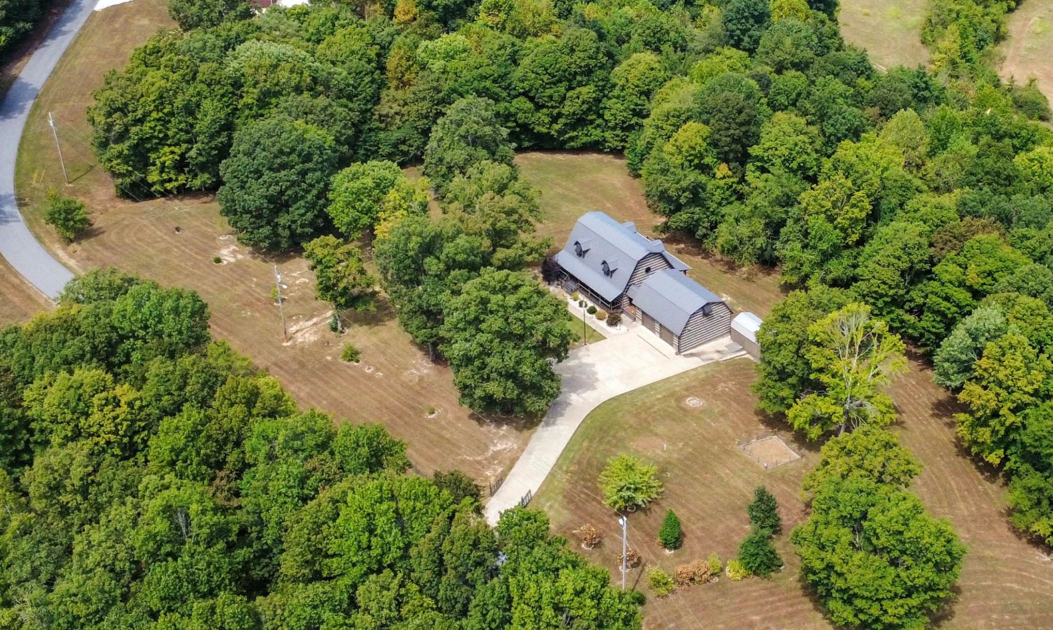 102 Highwater Road Waverly, TN 37185 - Photo 2 of 51 an aerial view of a house with a yard and large trees