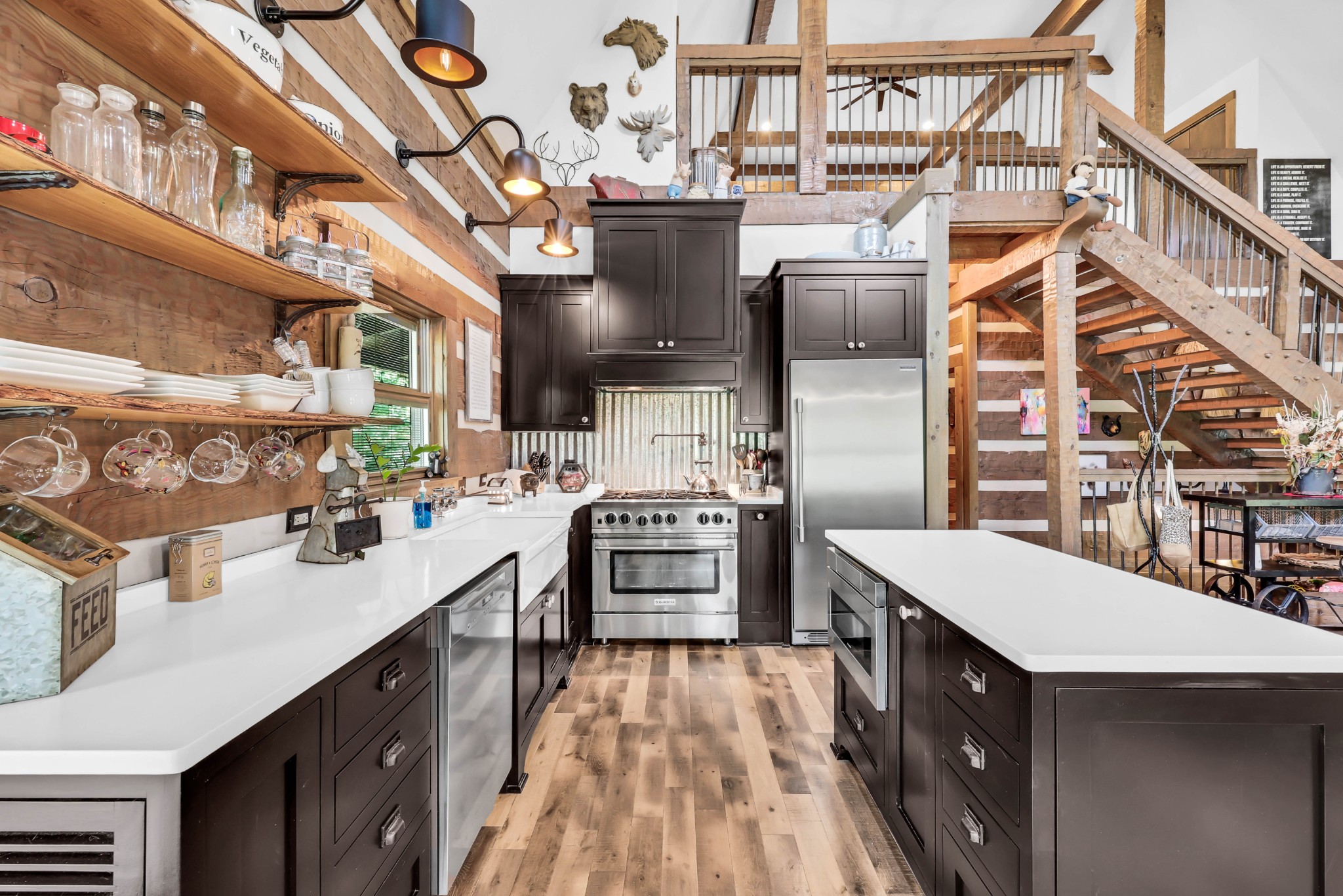 102 Highwater Road Waverly, TN 37185 - Photo 21 of 51 a kitchen with stainless steel appliances a stove and more cabinets