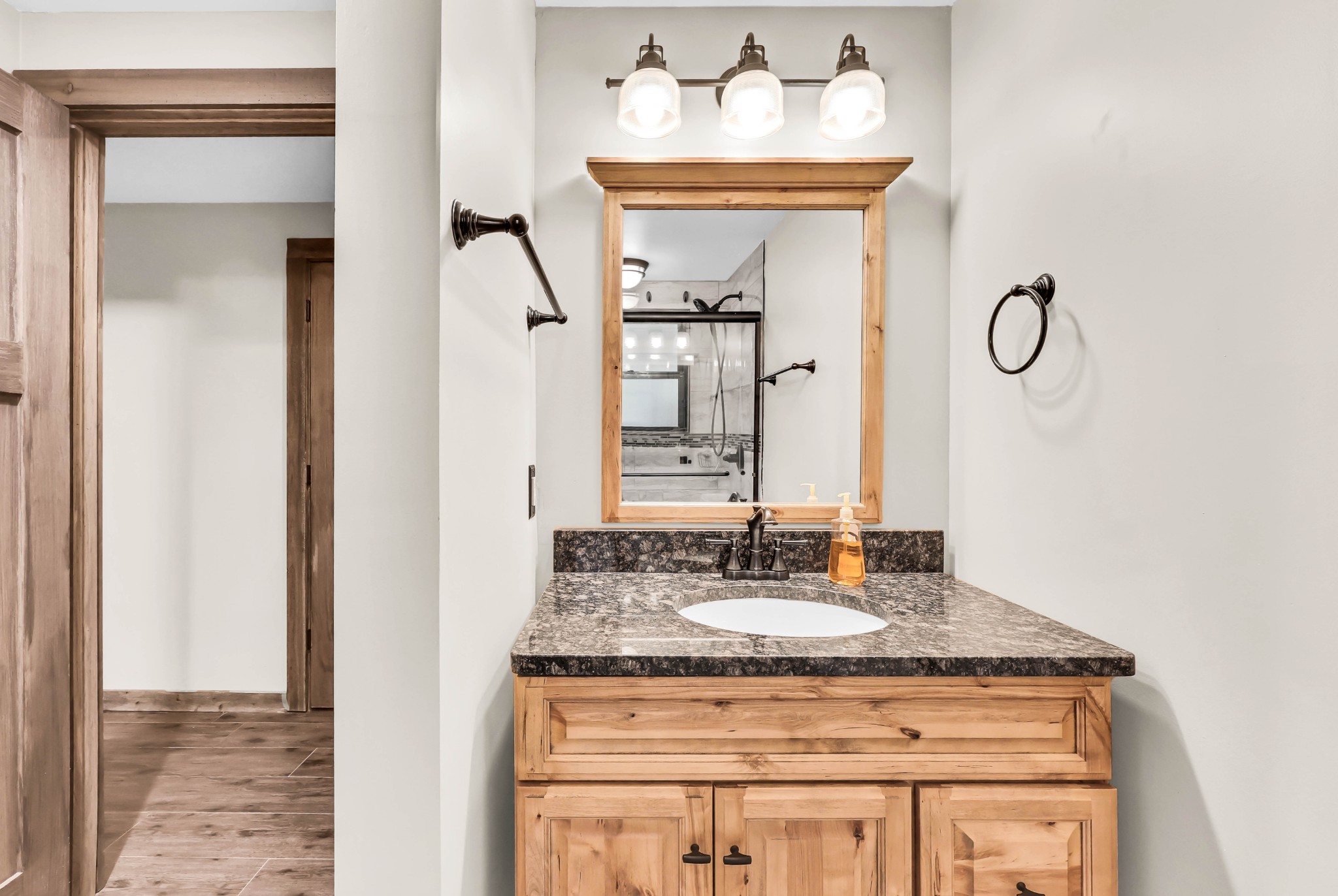 102 Highwater Road Waverly, TN 37185 - Photo 31 of 51 a bathroom with a granite countertop sink and a mirror