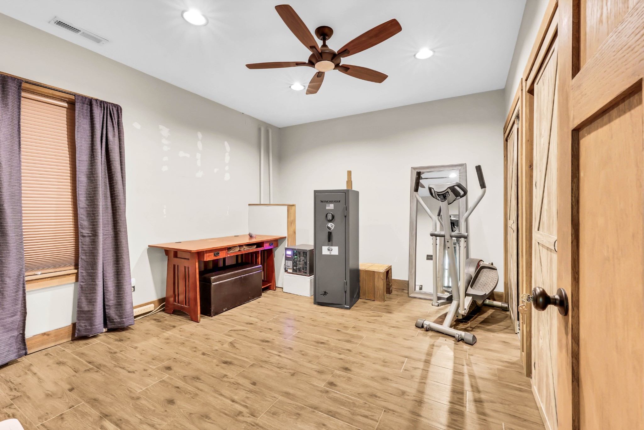 102 Highwater Road Waverly, TN 37185 - Photo 34 of 51 a room with a bed and a chandelier