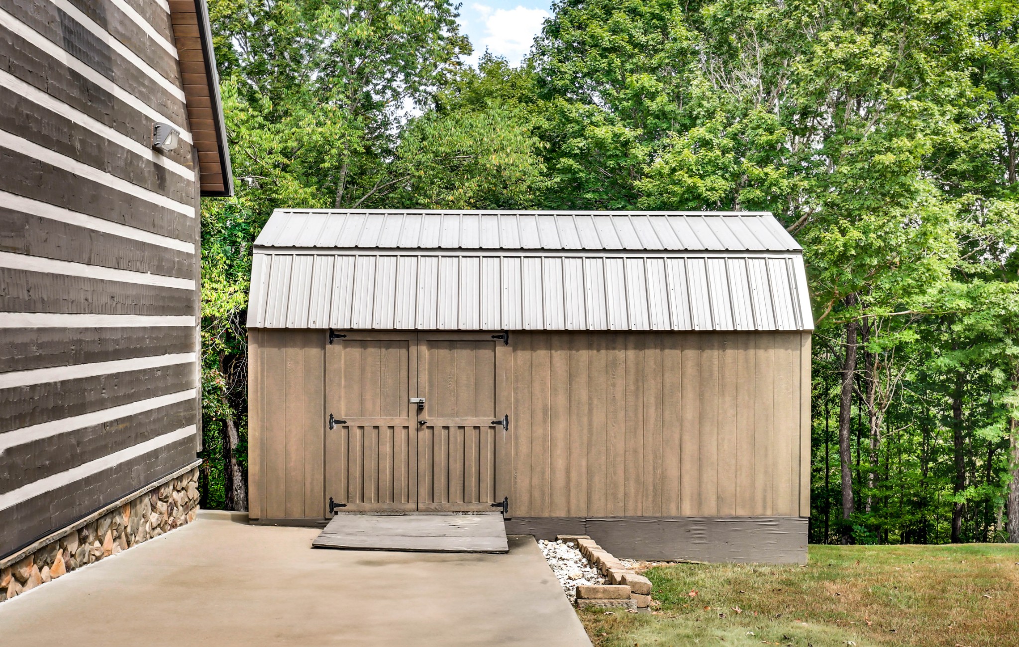102 Highwater Road Waverly, TN 37185 - Photo 43 of 51 a side view of a house with a iron gate