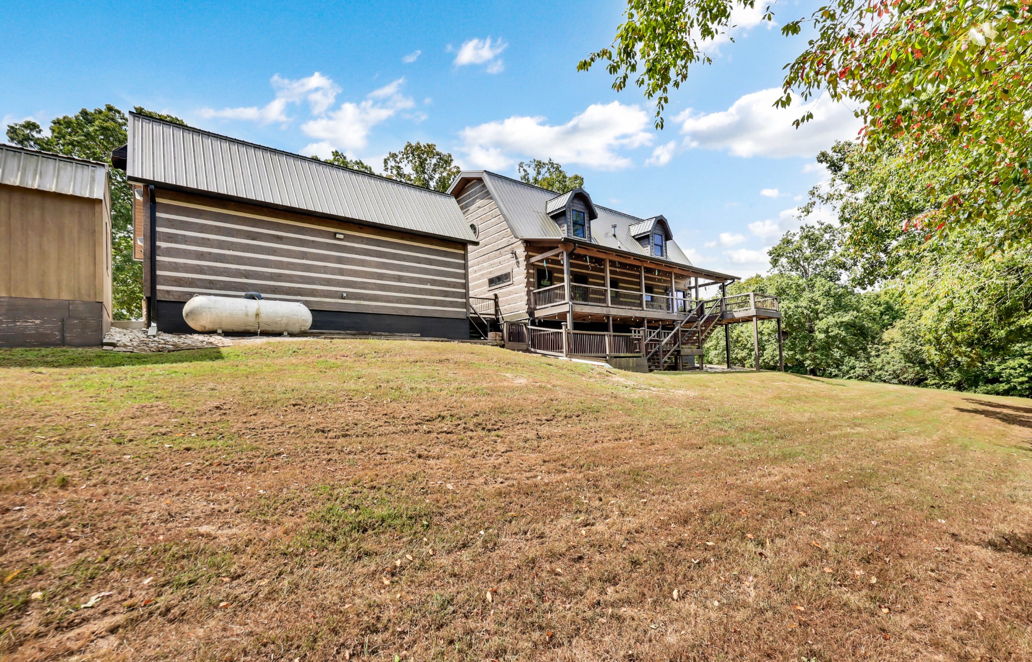 102 Highwater Road Waverly, TN 37185 - Photo 47 of 51 a view of a house with a yard and sitting area