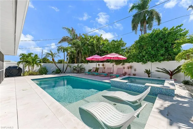 a view of pool with outdoor seating