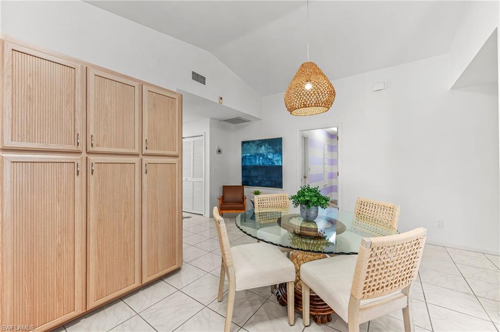 690 100th Avenue North Naples, FL 34108 - Photo 13 of 33 a dining room with furniture and window