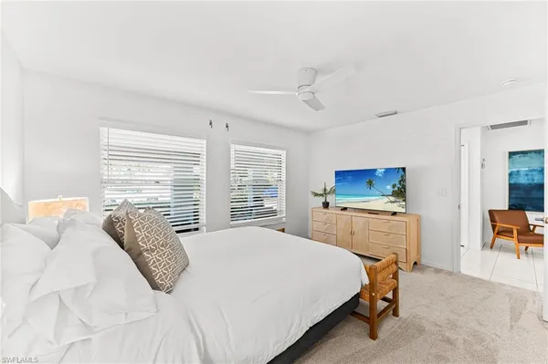 a bedroom with a bed and a desk