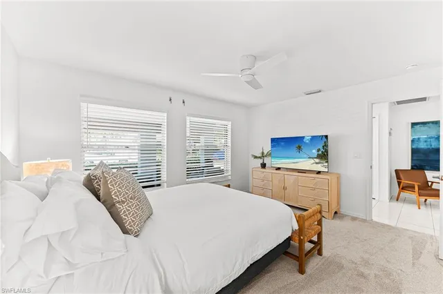 a bedroom with a bed and a desk