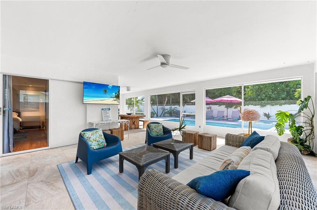 690 100th Avenue North Naples, FL 34108 - Photo 24 of 33 a living room with furniture and a large window