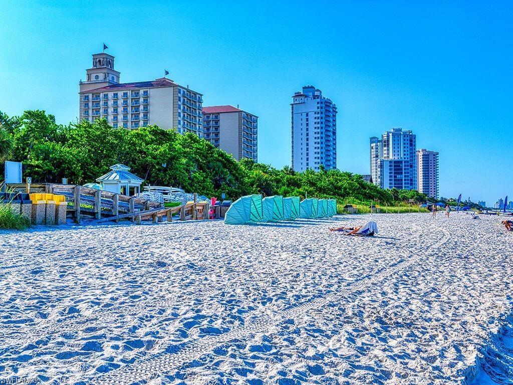 690 100th Avenue North Naples, FL 34108 - Photo 31 of 33 a view of a building with garden and trees