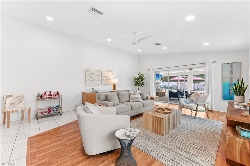 690 100th Avenue North Naples, FL 34108 - Photo 6 of 33 a living room with furniture and wooden floor