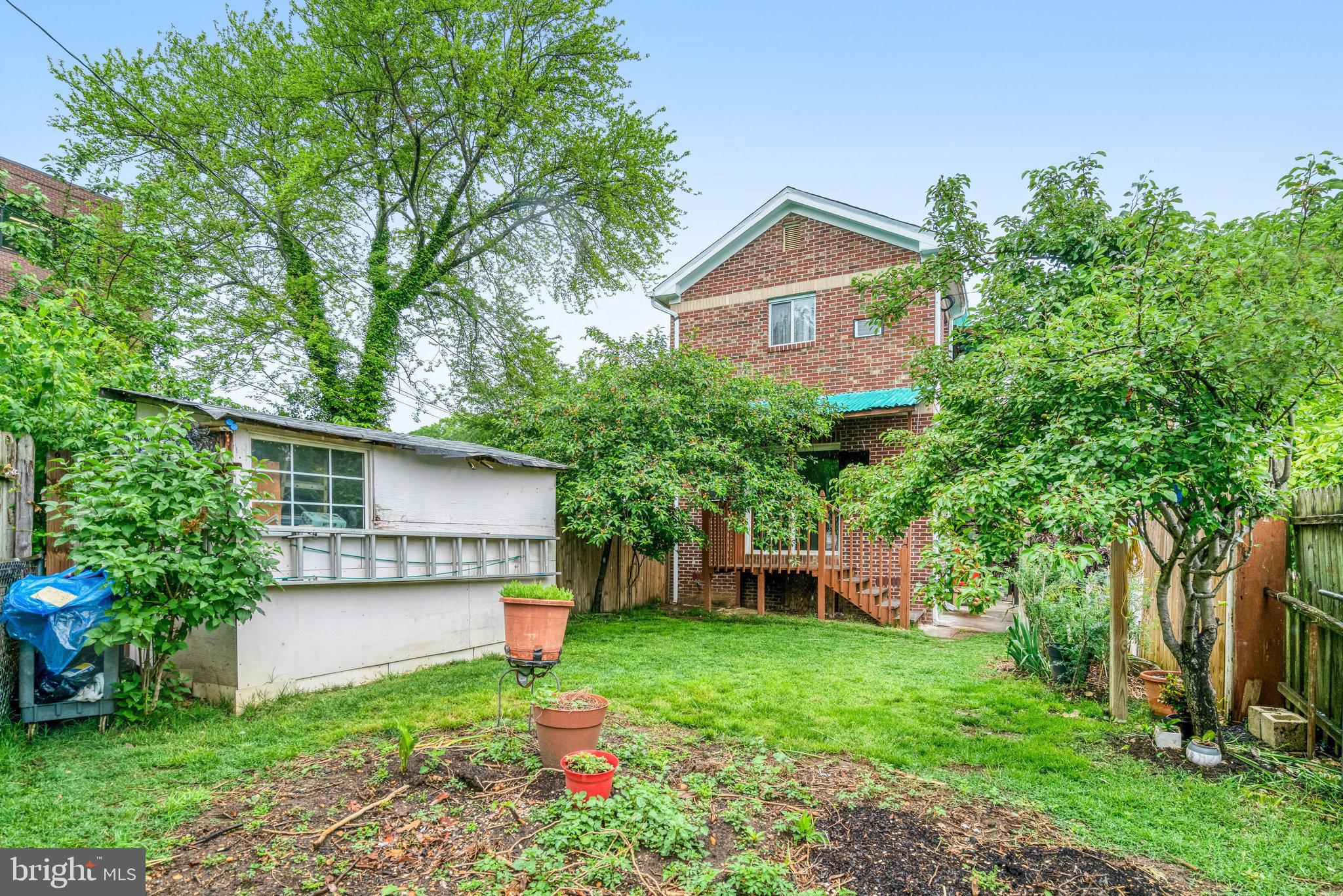 102 South Glebe Road Arlington, VA 22204 - Photo 52 of 52 a view of a house with a yard and plants