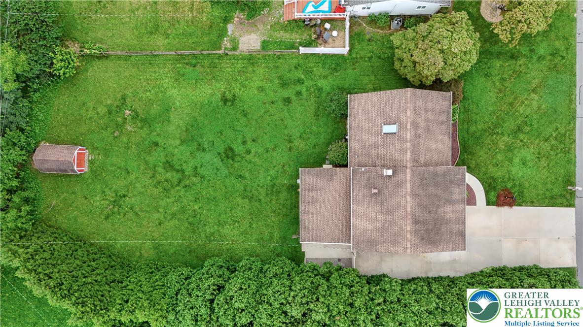 2750 Belaire Road Bethlehem, PA 18017 - Photo 49 of 56 An aerial perspective showcases a deep grassy lawn bordered by mature privacy hedges.