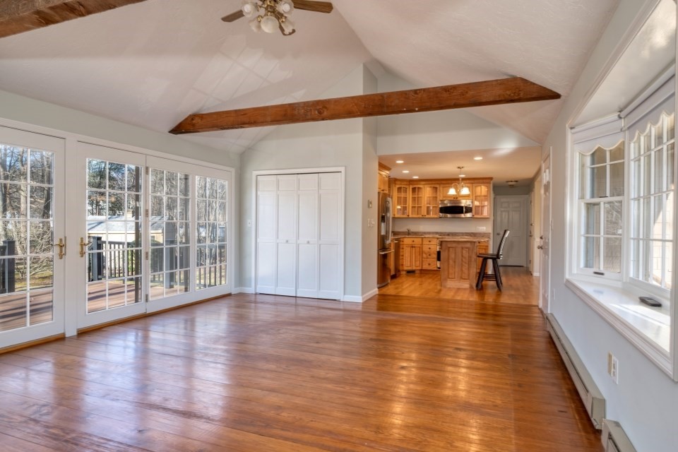21 Strawberry Lane Whitman, MA 02382 - Photo 12 of 39 a view of an entryway with wooden floor and windows