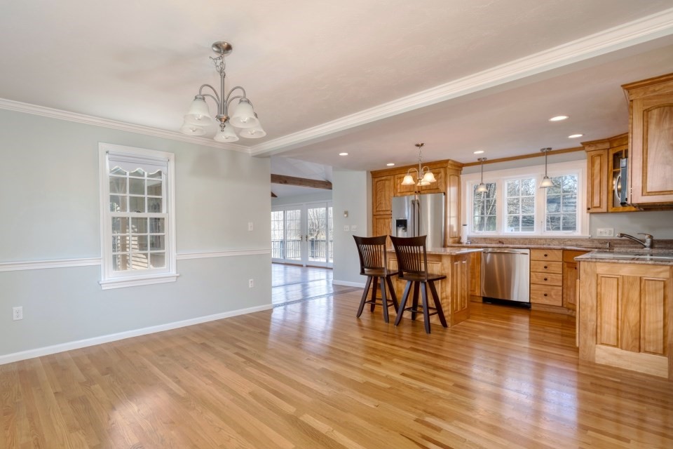 21 Strawberry Lane Whitman, MA 02382 - Photo 17 of 39 a view of a dining room with furniture and wooden floor