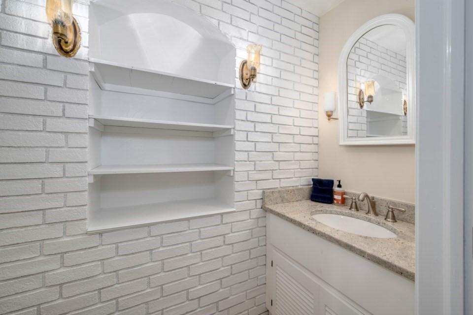 21 Strawberry Lane Whitman, MA 02382 - Photo 23 of 39 a bathroom with a sink and a mirror