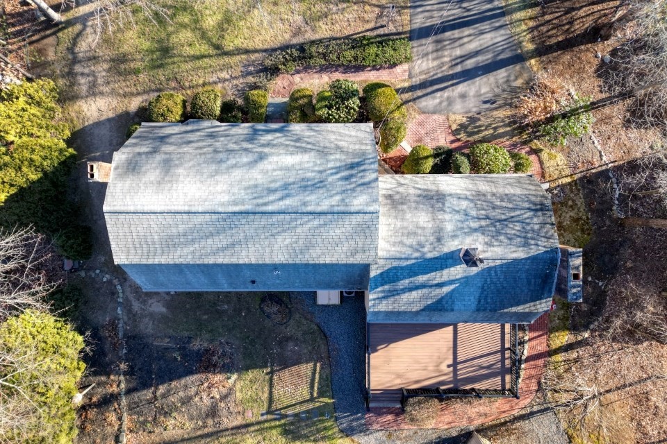 21 Strawberry Lane Whitman, MA 02382 - Photo 30 of 39 a view of a wooden house with a yard and wooden fence
