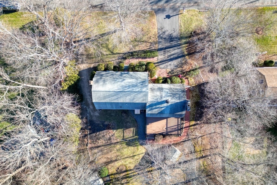 21 Strawberry Lane Whitman, MA 02382 - Photo 32 of 39 a view of a backyard with sitting area