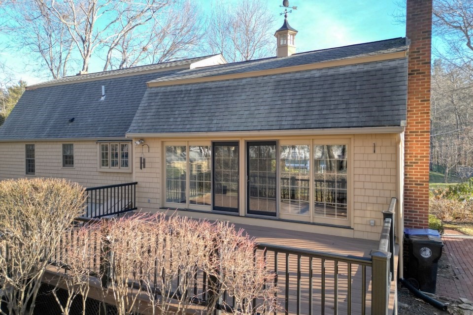 21 Strawberry Lane Whitman, MA 02382 - Photo 6 of 39 a front view of a house with a large tree