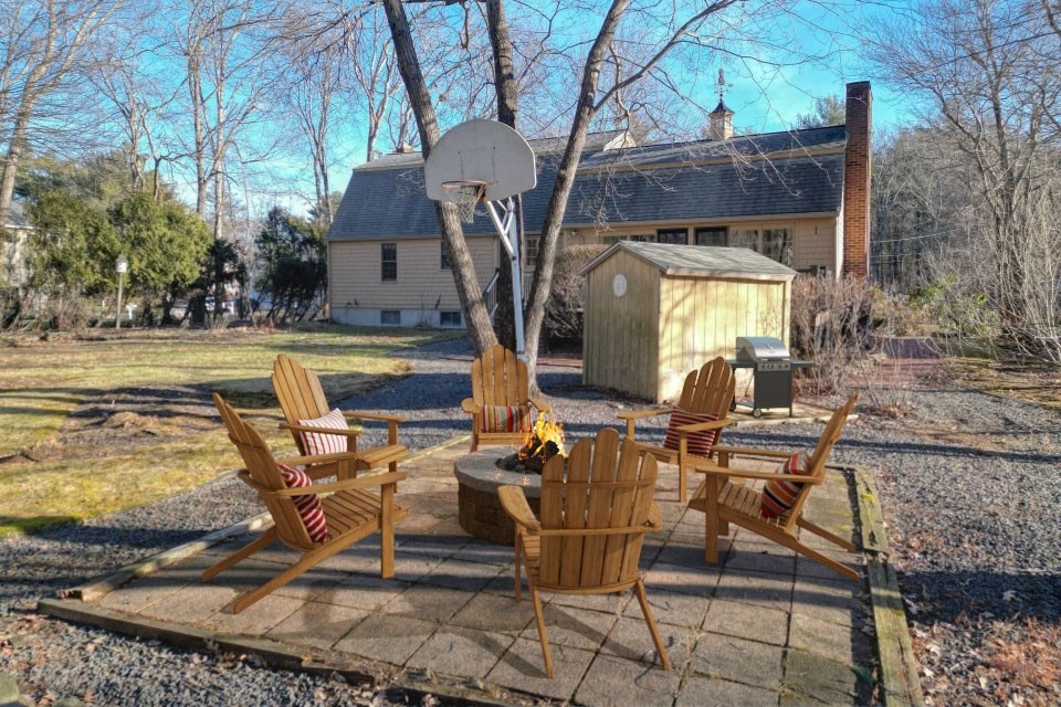 21 Strawberry Lane Whitman, MA 02382 - Photo 8 of 39 a view of house with outdoor seating space