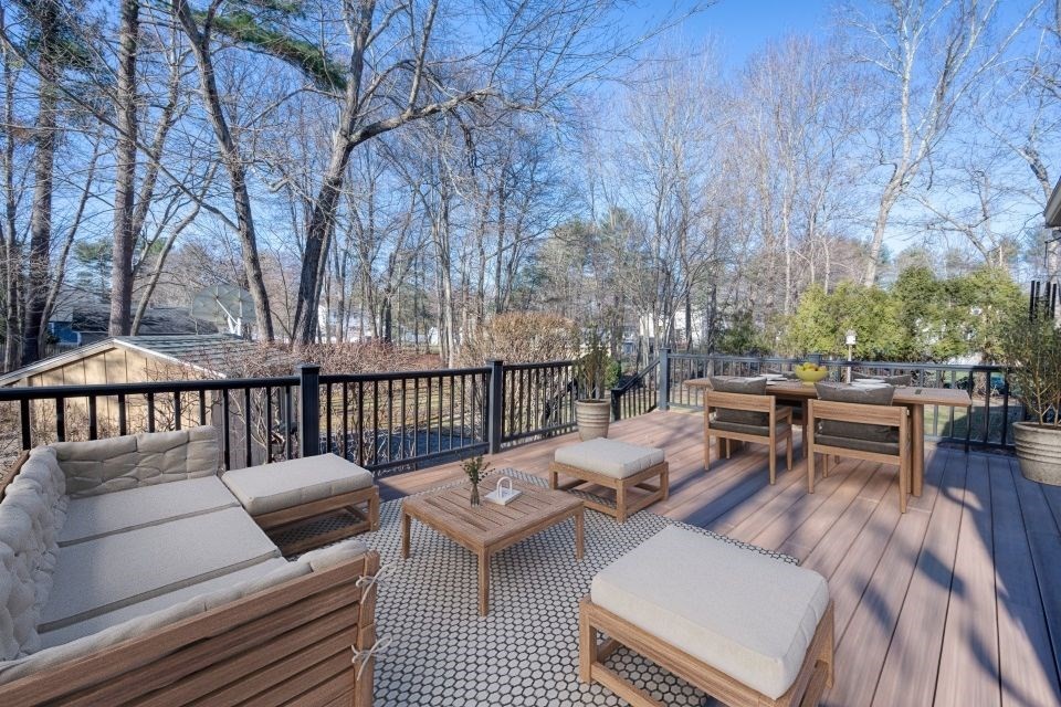 21 Strawberry Lane Whitman, MA 02382 - Photo 10 of 39 a view of a patio with a dining table and chairs with wooden floor and fence