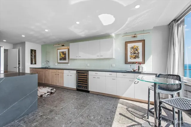 a kitchen with a sink and a stove top oven