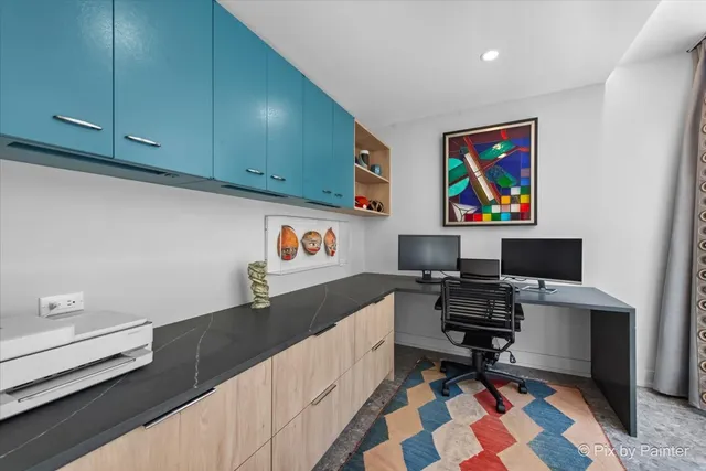 a workspace with furniture and window