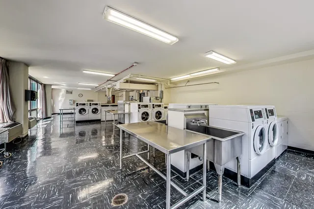 a backyard of a building with lots of green space