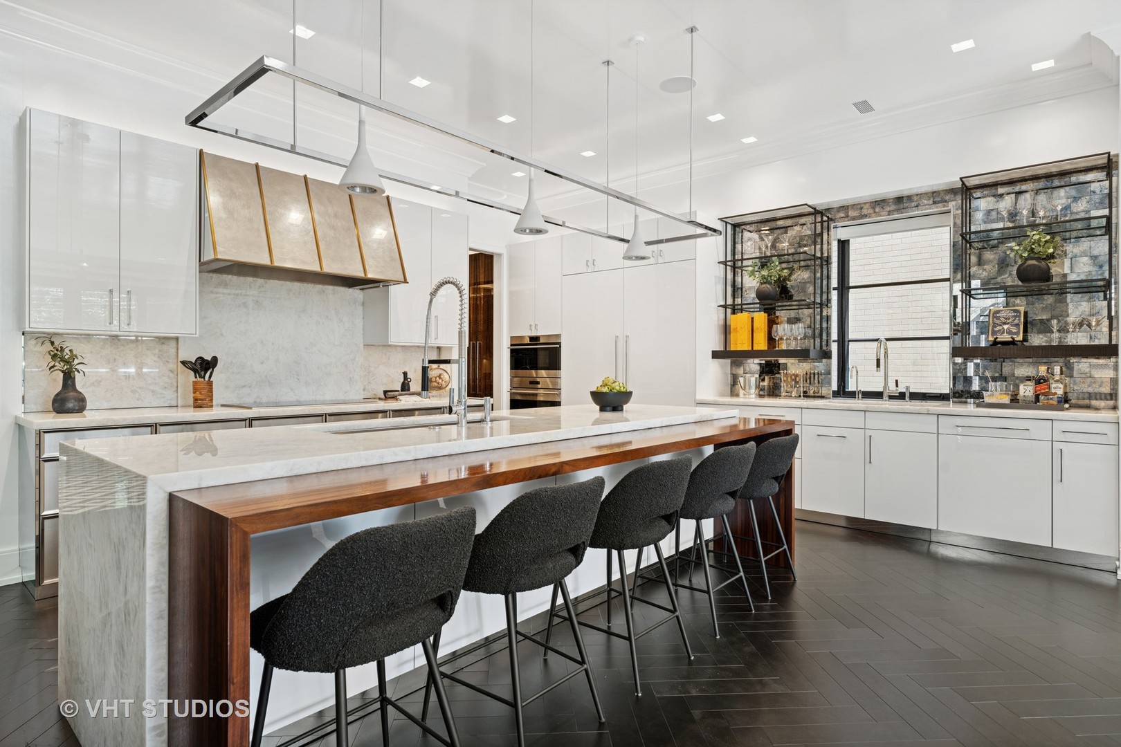 1878 North Orchard Street Chicago, IL 60614 - Photo 18 of 80 a kitchen with stainless steel appliances granite countertop a table chairs sink and cabinets