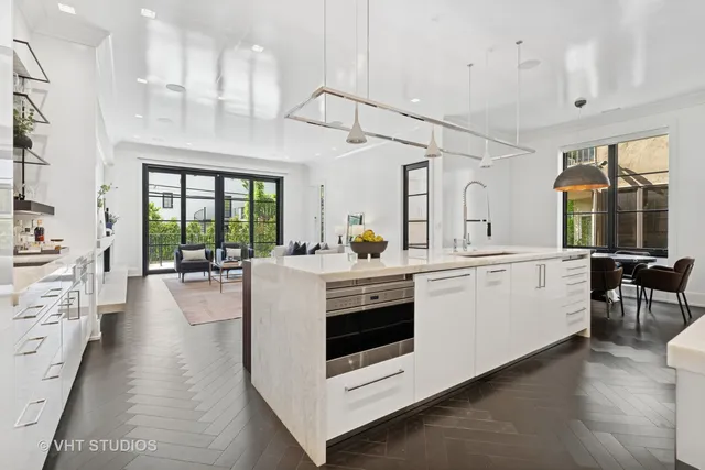 a living room with furniture and view of kitchen