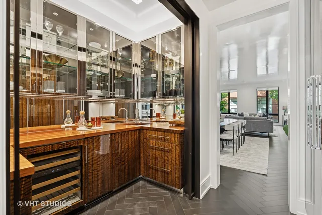 an empty room with windows and fireplace