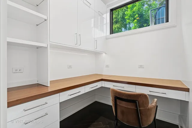 a view of kitchen with furniture and an entryway