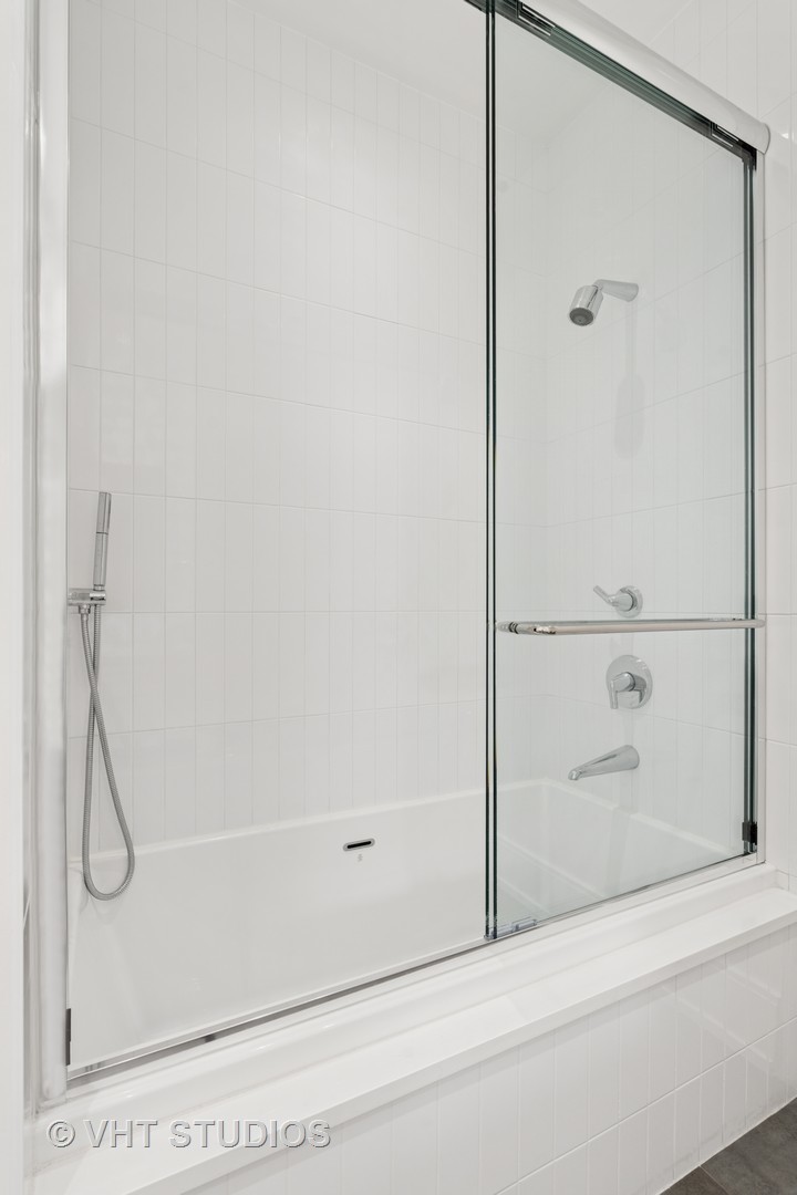 1878 North Orchard Street Chicago, IL 60614 - Photo 52 of 80 a bathroom with a glass shower door