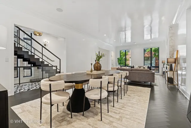 a view of a a dining room with furniture window and wooden floor