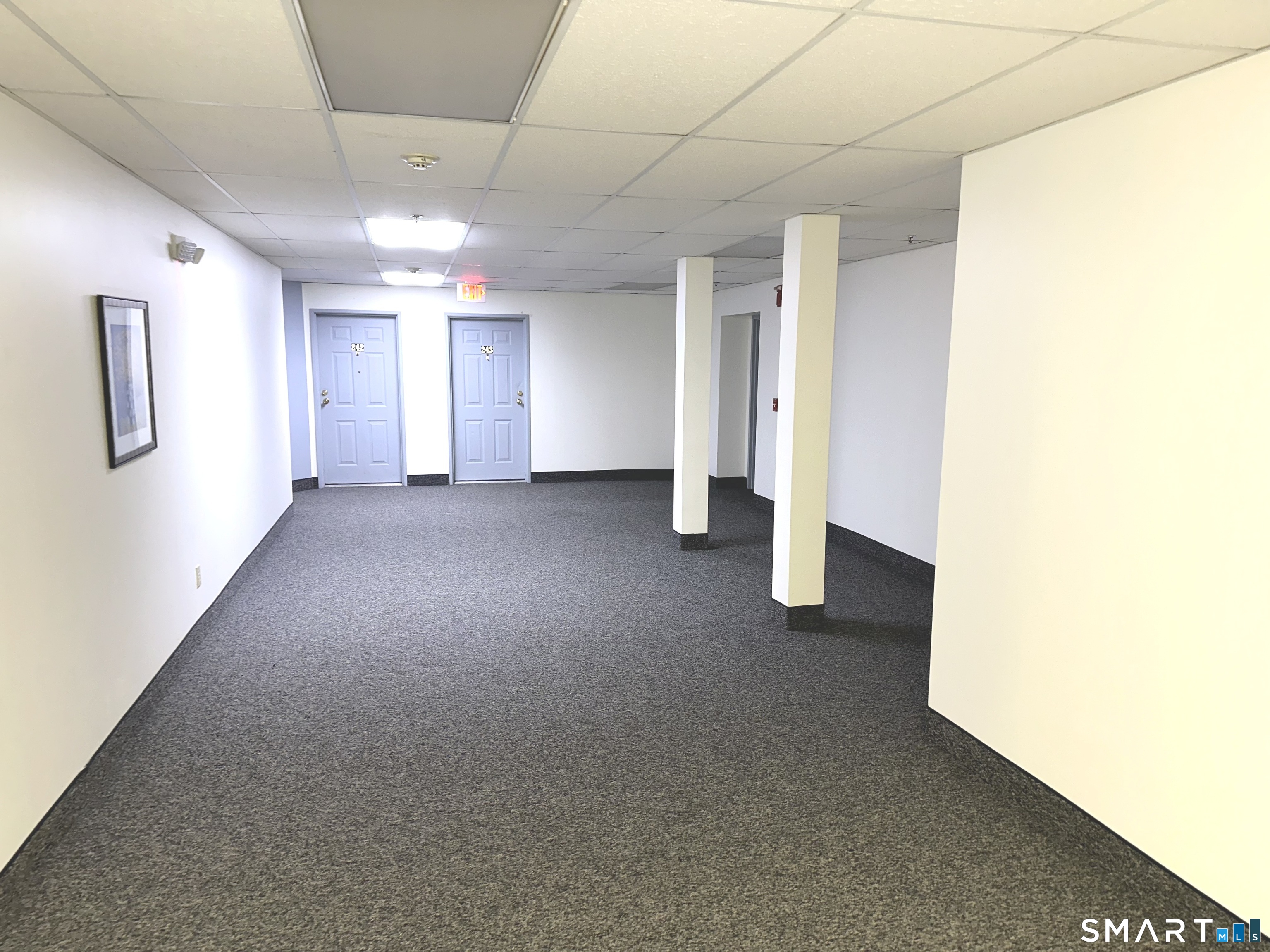 243 Judd Square, Unit 243 Wallingford, CT 06492 - Photo 3 of 17 a view of empty room with windows